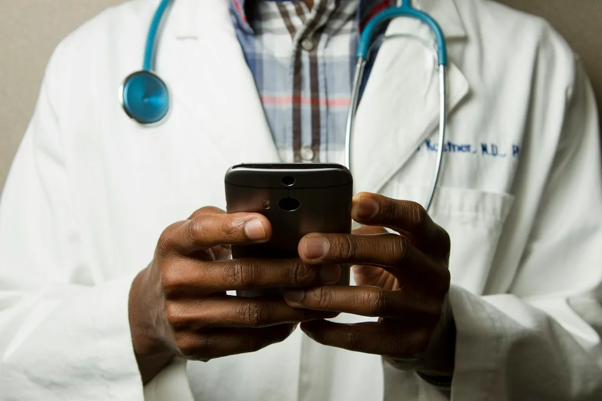A healthcare professional using a digital device